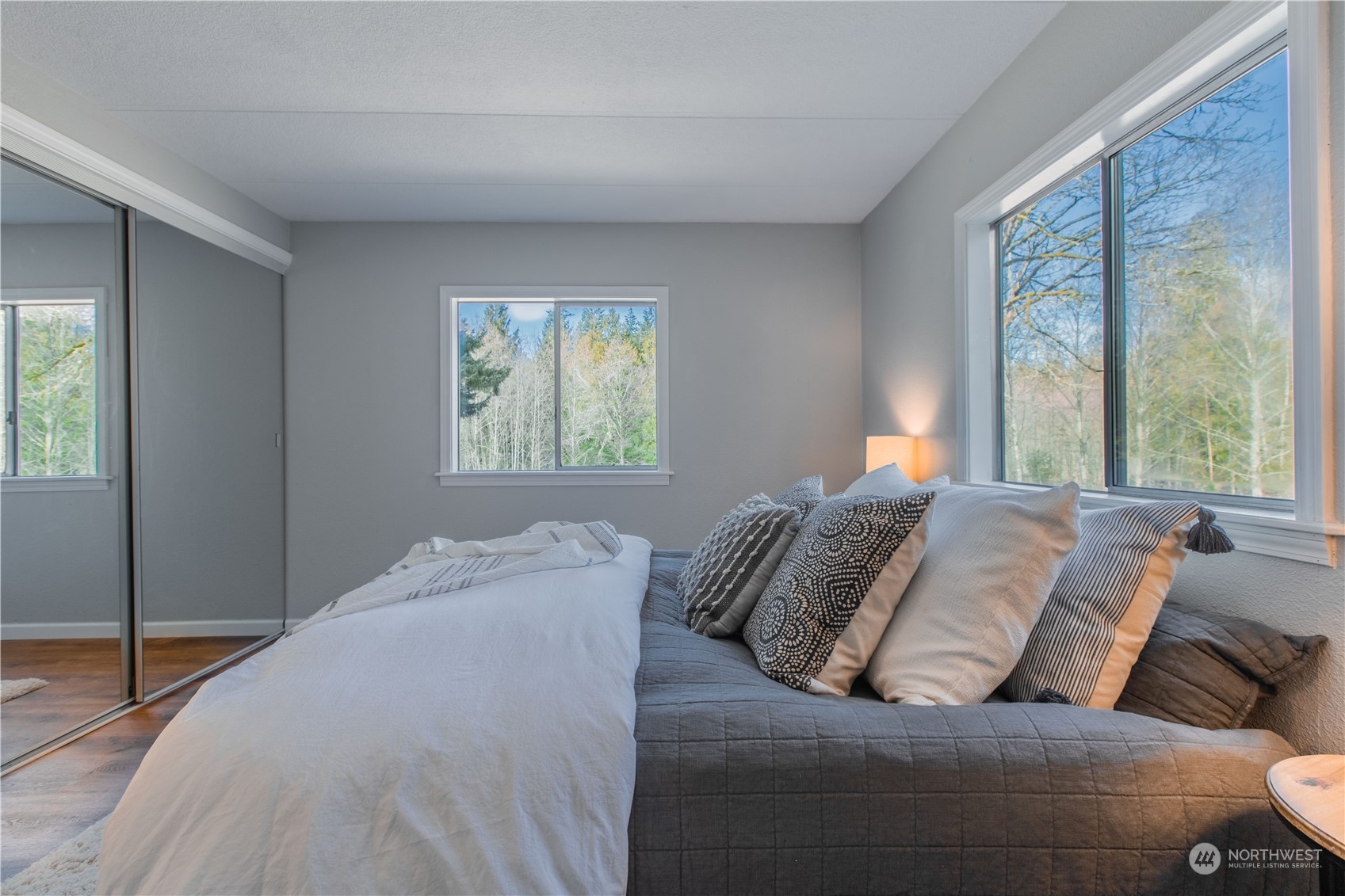 2124 Butler Creek Road Sedro-Woolley, WA 98284 - Photo 14 of 40 a bed sitting in a bedroom next to a window