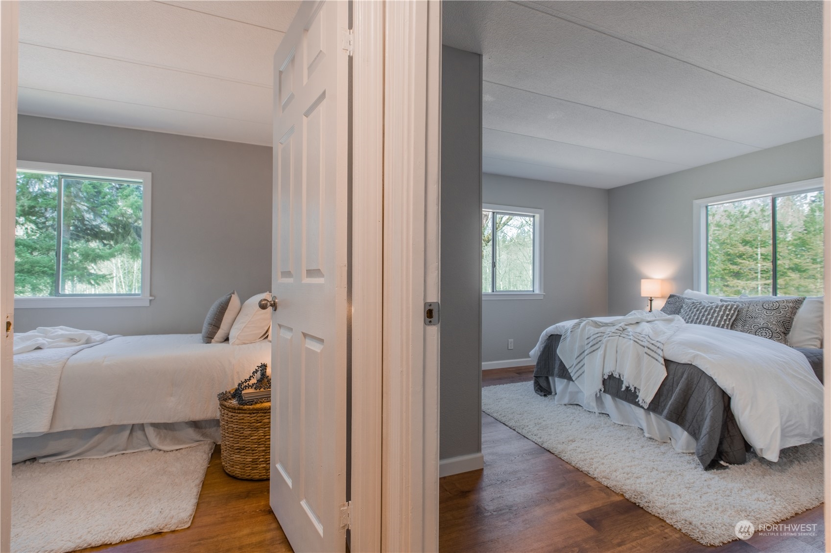 2124 Butler Creek Road Sedro-Woolley, WA 98284 - Photo 15 of 40 a bed sitting in a bedroom next to a window