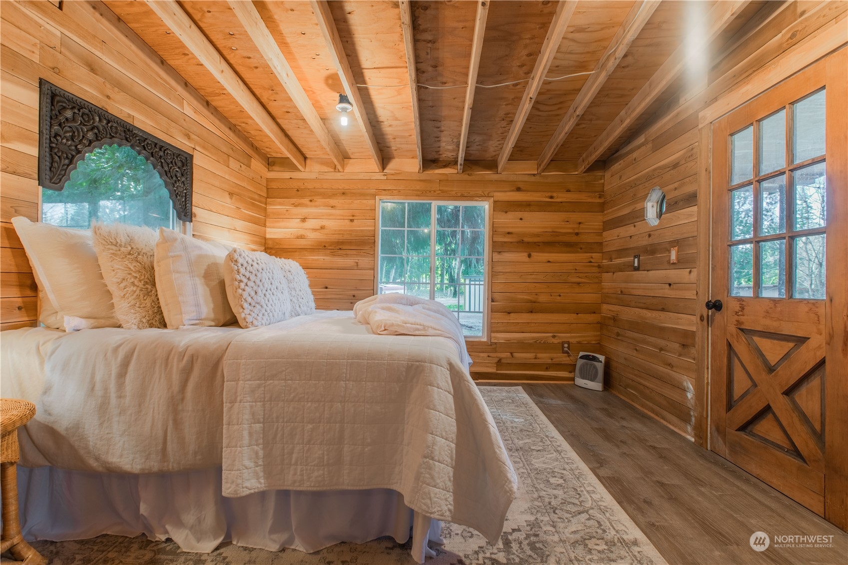 2124 Butler Creek Road Sedro-Woolley, WA 98284 - Photo 23 of 40 a bedroom with a bed and wooden floor