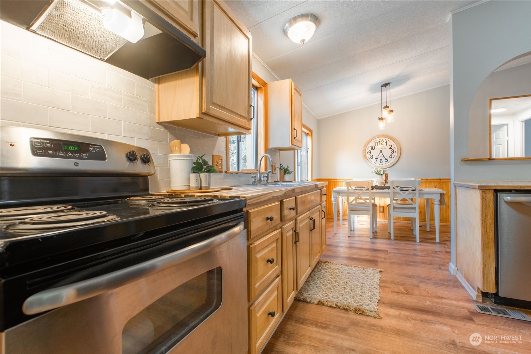 2124 Butler Creek Road Sedro-Woolley, WA 98284 - Photo 6 of 40 a kitchen with stainless steel appliances a stove a sink and a refrigerator