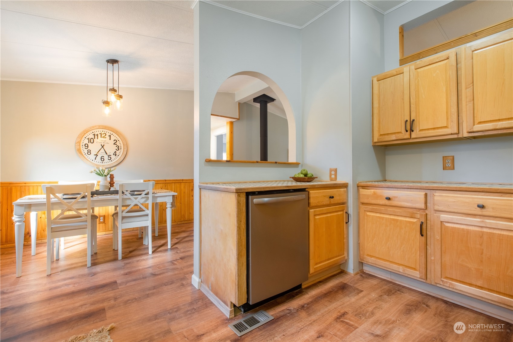2124 Butler Creek Road Sedro-Woolley, WA 98284 - Photo 7 of 40 a kitchen with stainless steel appliances granite countertop a stove a sink dishwasher and white cabinets with wooden floor
