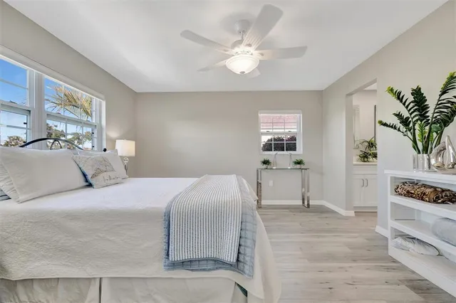 a bedroom with a large bed and a window