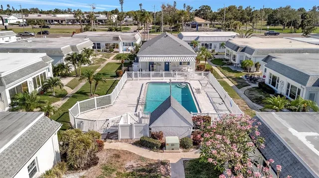 a aerial view of a house with a yard