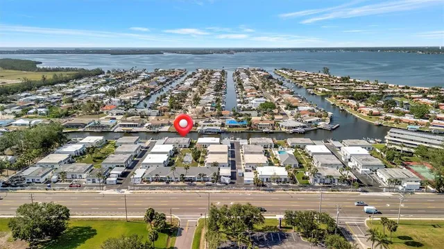 an aerial view of a house with a ocean view