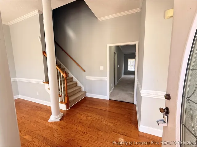 a view of entryway with wooden floor