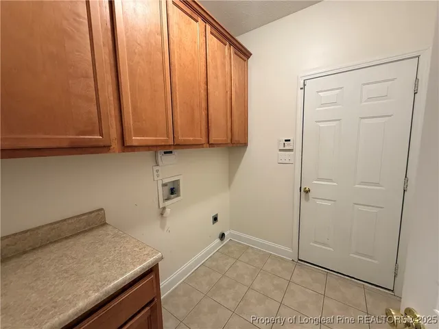 a view of storage and utility room with washer and dryer