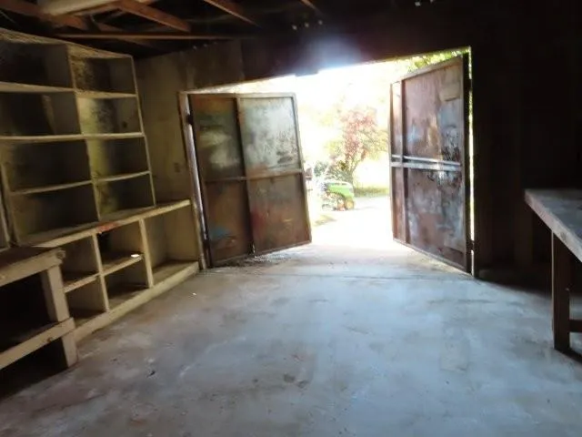 a view of an empty room with a fireplace