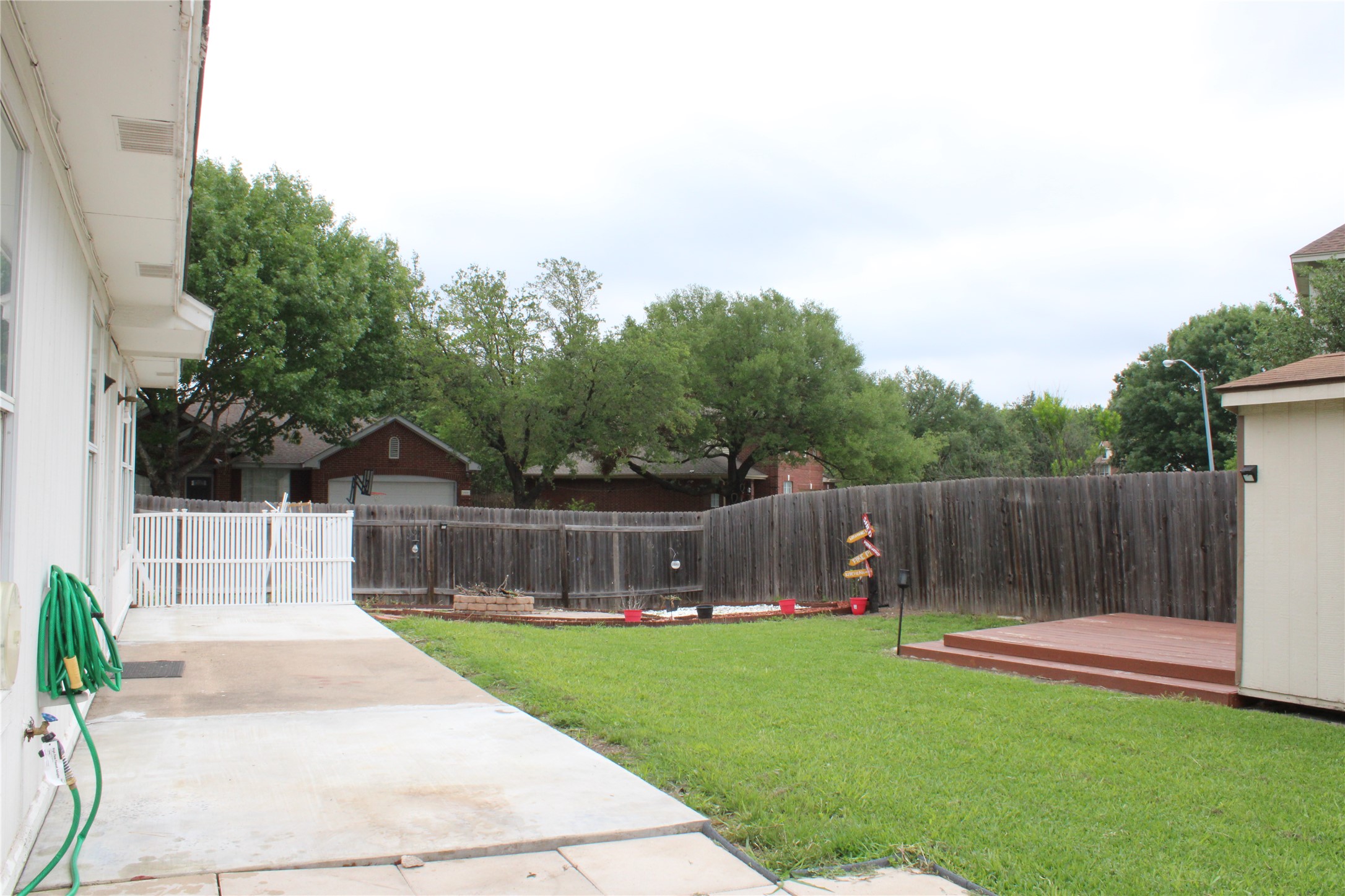 16205 Glorious Lane Pflugerville, TX 78660 - Photo 29 of 30 a view of a backyard with a garden