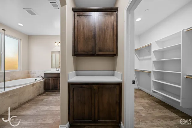 a bathroom with a sink a toilet and bathtub