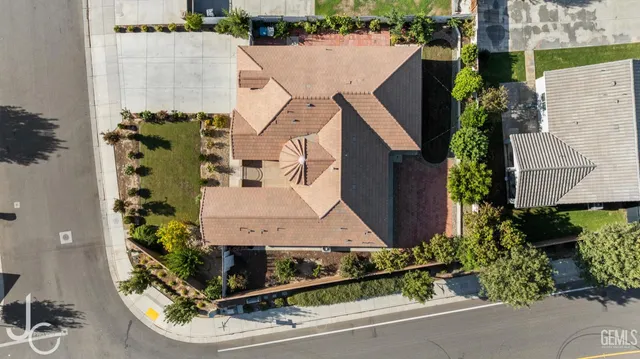 an aerial view of a house with a garden