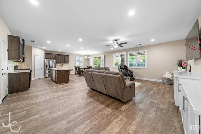 a living room with furniture window and a wooden floor