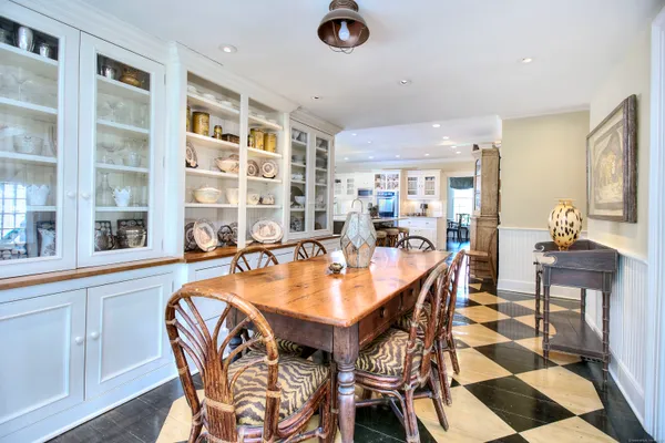 a dining room with a table and chairs