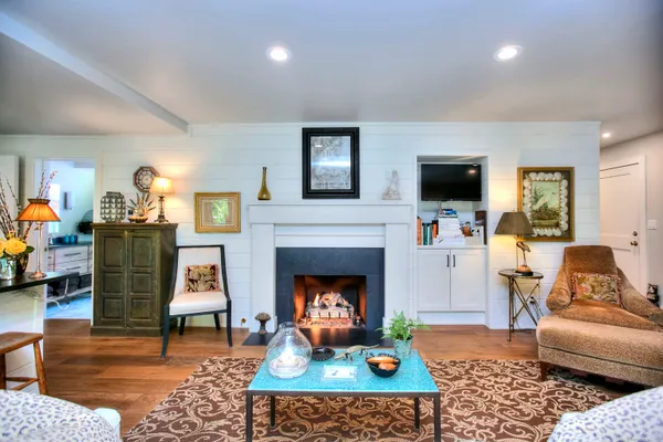 a living room with furniture and a fireplace
