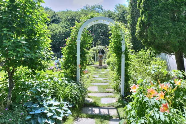 a view of patio with a table and chairs and potted plants