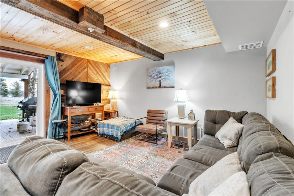 36044 Highway 66 Crown, PA 16233 - Photo 12 of 48 a living room with furniture and a flat screen tv