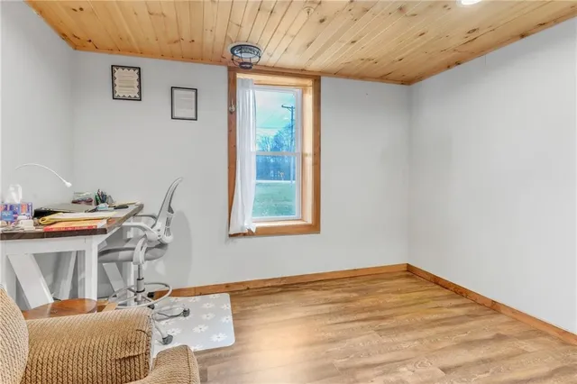 a living room with a couch and a wooden floor