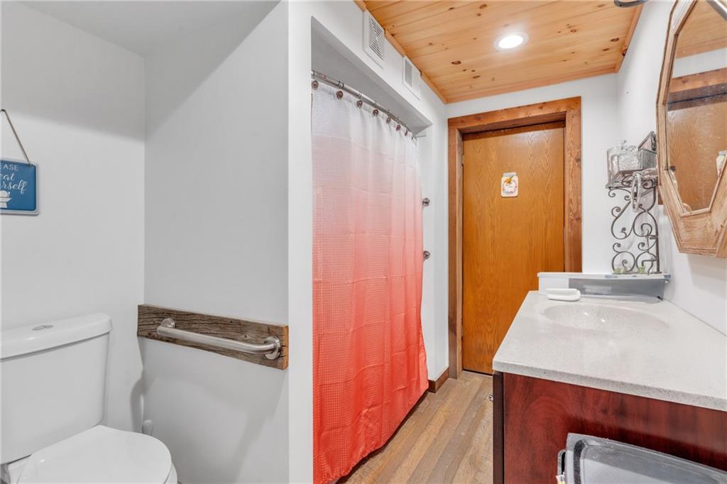 36044 Highway 66 Crown, PA 16233 - Photo 19 of 48 a bathroom with a granite countertop sink toilet and shower