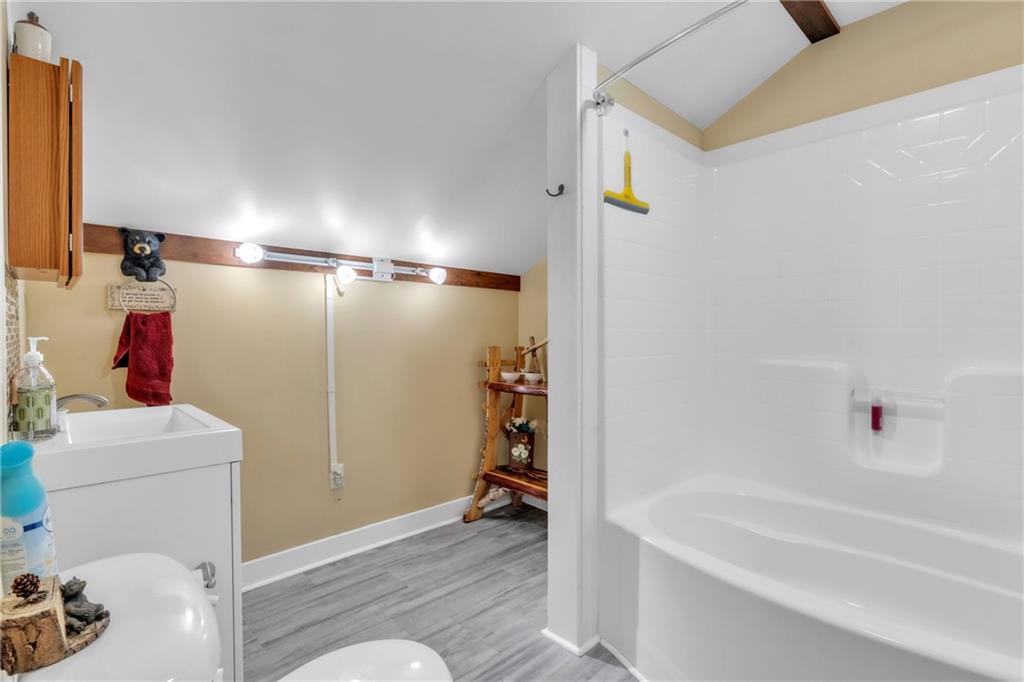 36044 Highway 66 Crown, PA 16233 - Photo 24 of 48 a bathroom with a bathtub and a shower