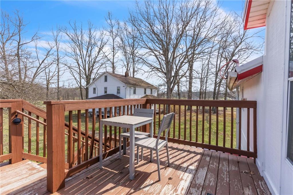 36044 Highway 66 Crown, PA 16233 - Photo 26 of 48 a view of a roof deck with wooden floor and fence
