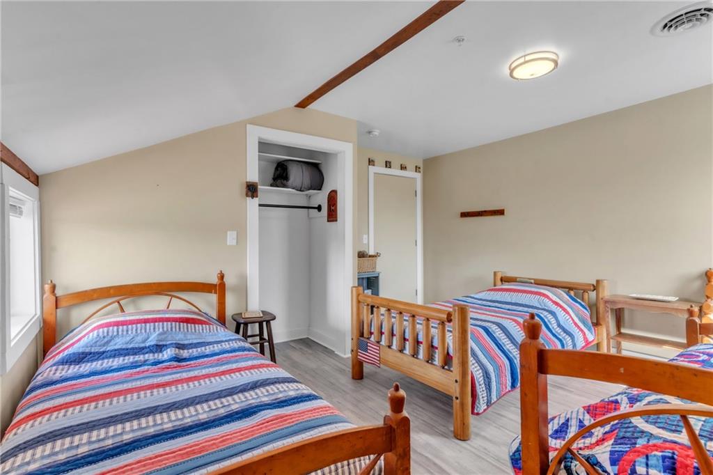 36044 Highway 66 Crown, PA 16233 - Photo 32 of 48 a bedroom with bed and a lamp on dresser