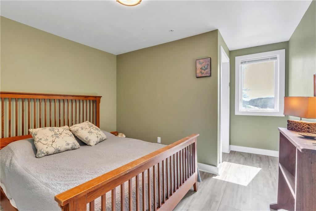 36044 Highway 66 Crown, PA 16233 - Photo 34 of 48 a bedroom with a bed and a window