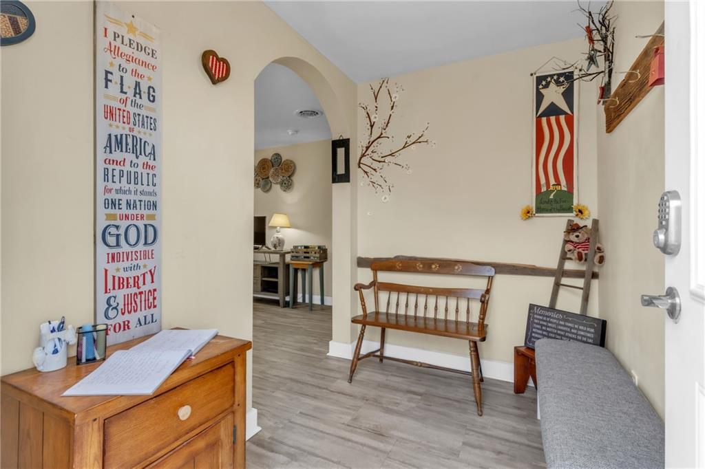 36044 Highway 66 Crown, PA 16233 - Photo 36 of 48 a hallway with a table and a dresser
