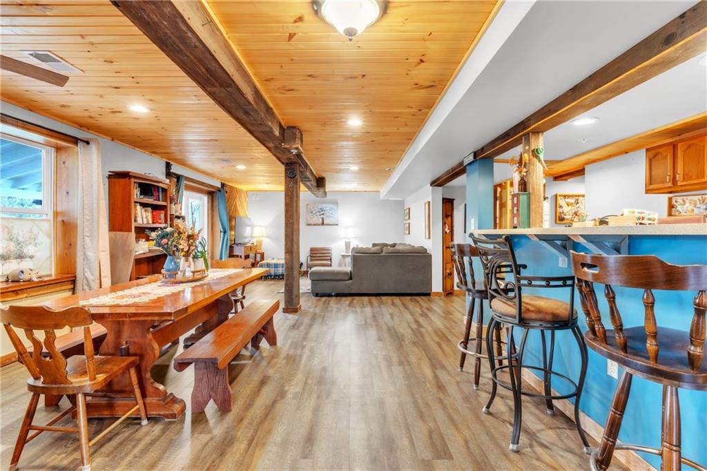 36044 Highway 66 Crown, PA 16233 - Photo 10 of 48 a dining room with furniture and wooden floor