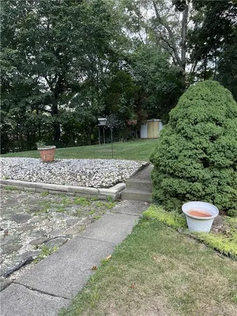 a view of a backyard of the house