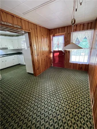 a view of a utility room with windows