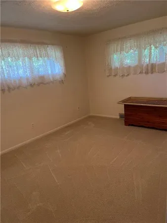 a view of hallway with stainless steel appliances