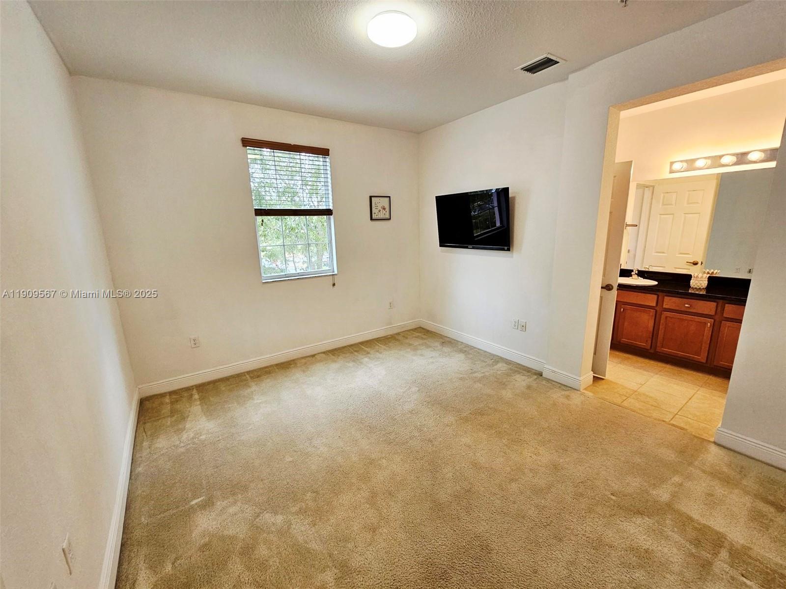 809 Southwest 147th Avenue, Unit 1401 Pembroke Pines, FL 33027 - Photo 11 of 19 an empty room with windows