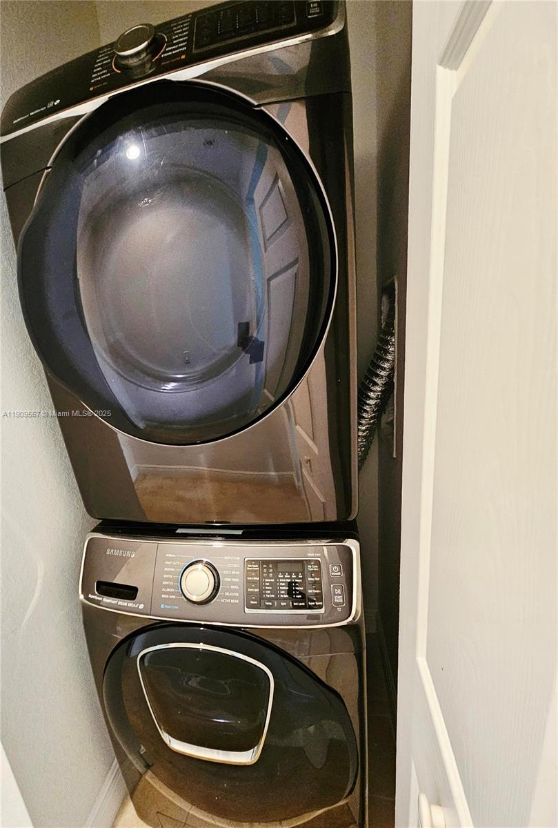 809 Southwest 147th Avenue, Unit 1401 Pembroke Pines, FL 33027 - Photo 14 of 19 a close up view of washer and dryer