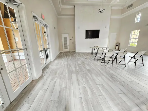 a view of a livingroom with furniture and hardwood floor