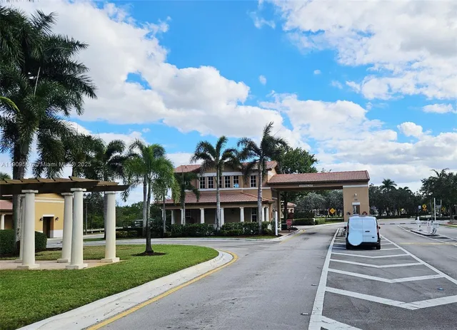 a front view of a building with garden