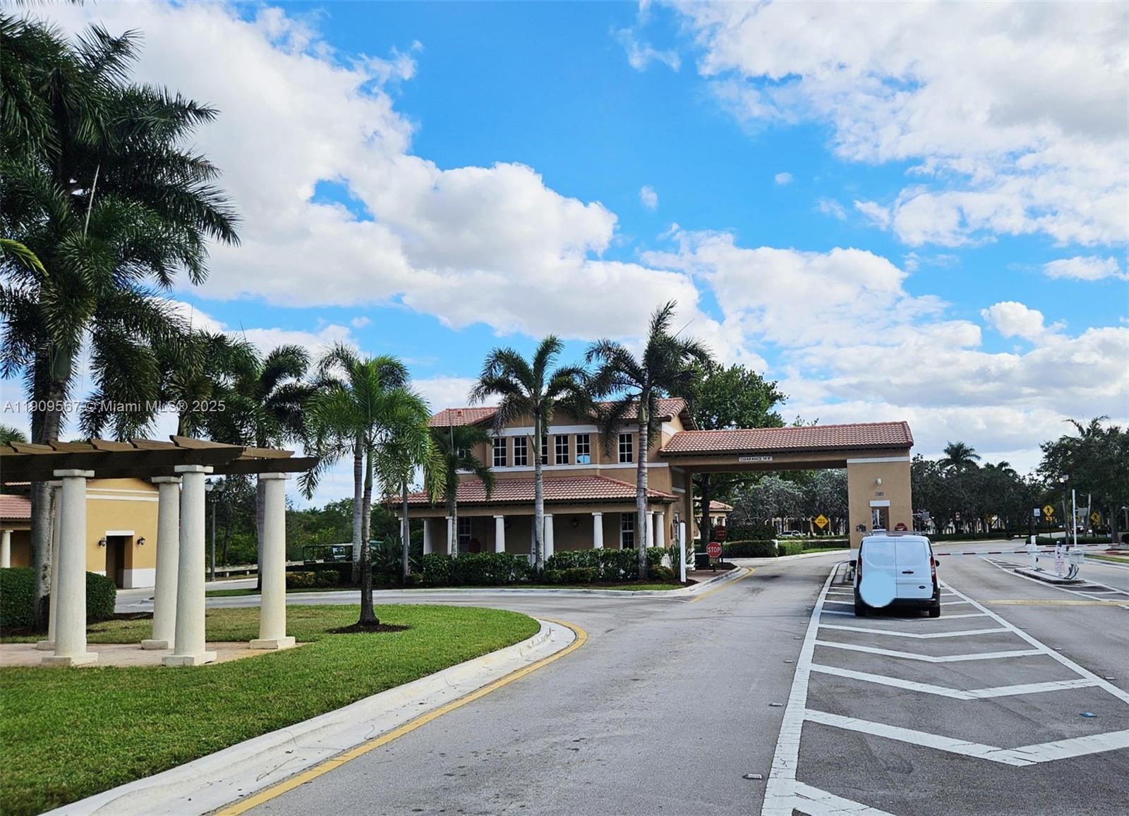 809 Southwest 147th Avenue, Unit 1401 Pembroke Pines, FL 33027 - Photo 19 of 19 a front view of a building with garden