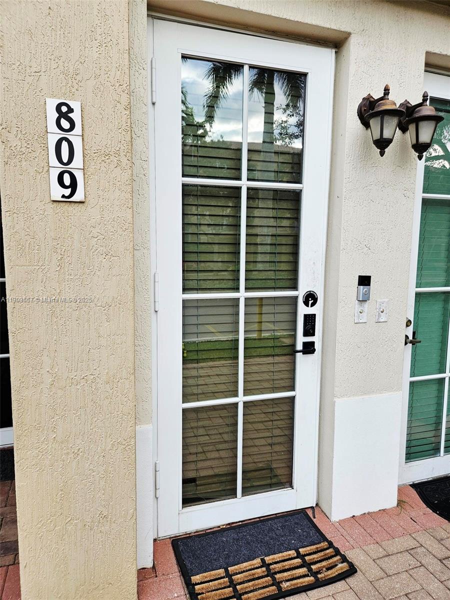 809 Southwest 147th Avenue, Unit 1401 Pembroke Pines, FL 33027 - Photo 3 of 19 a view of a door and the balcony