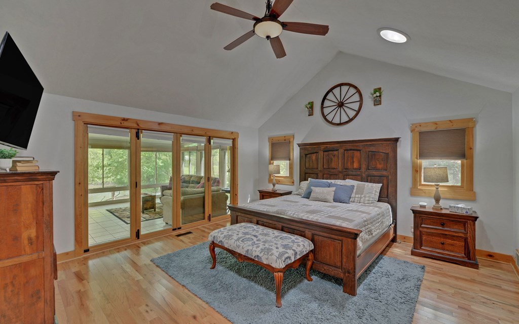 321 Call-Wright Road Ellijay, GA 30540 - Photo 14 of 92 a bedroom with a bed and a chandelier