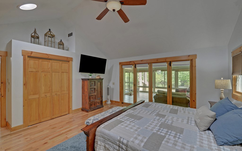 321 Call-Wright Road Ellijay, GA 30540 - Photo 15 of 92 a bedroom with a bed and a flat tv screen on the dresser