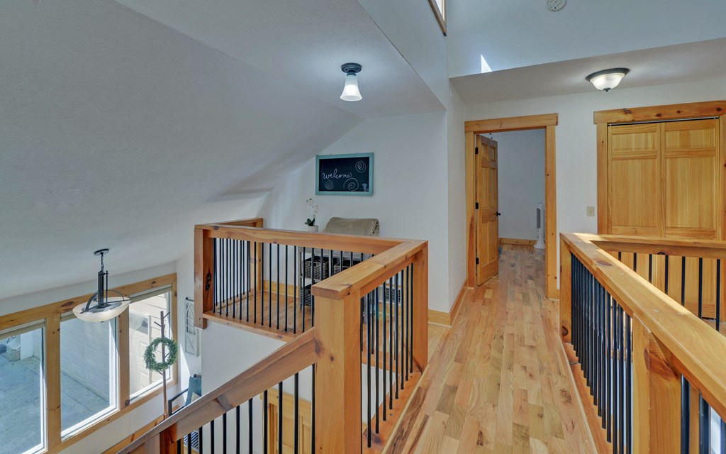 321 Call-Wright Road Ellijay, GA 30540 - Photo 26 of 92 a view of a hallway with wooden floor and windows