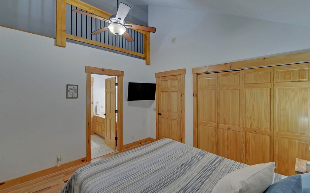 321 Call-Wright Road Ellijay, GA 30540 - Photo 33 of 92 a bedroom with a bed and wooden door