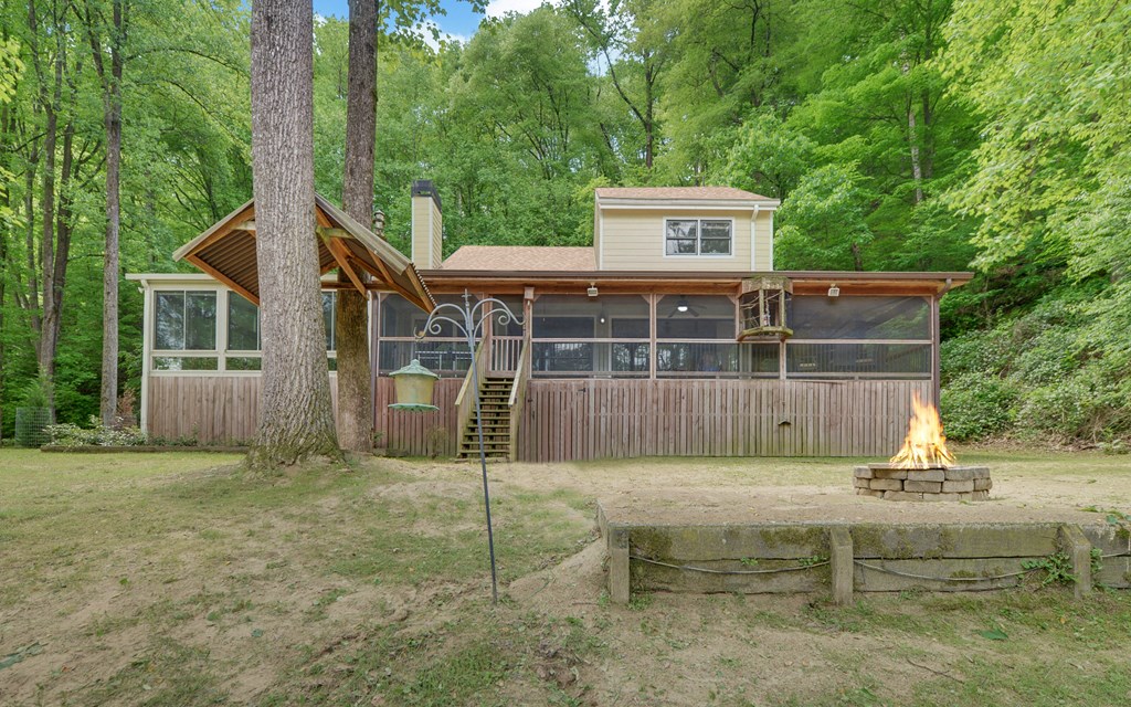 321 Call-Wright Road Ellijay, GA 30540 - Photo 39 of 92 a view of a house with a wooden deck and a yard