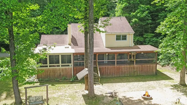 a kitchen that has a lot of cabinets and wooden floor