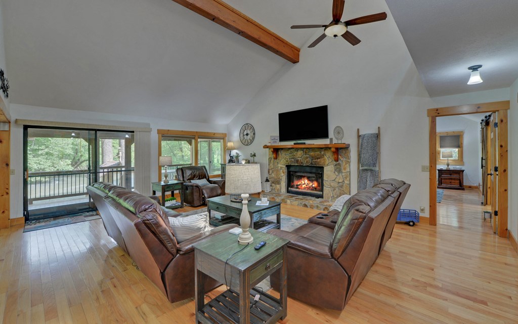 321 Call-Wright Road Ellijay, GA 30540 - Photo 5 of 92 a living room with furniture a flat screen tv and a fireplace