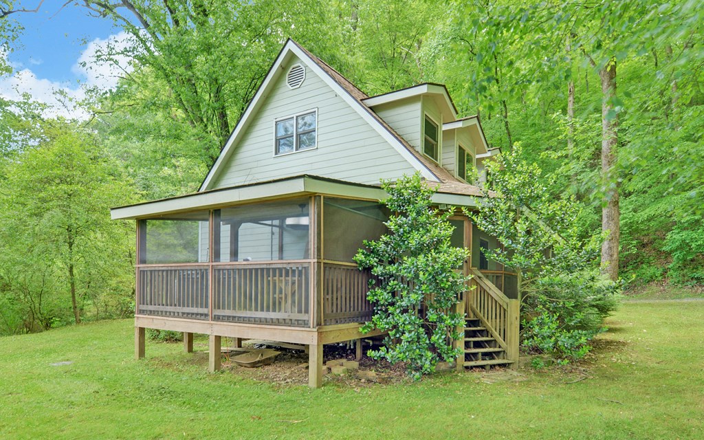 321 Call-Wright Road Ellijay, GA 30540 - Photo 77 of 92 a front view of a house with a garden and plants