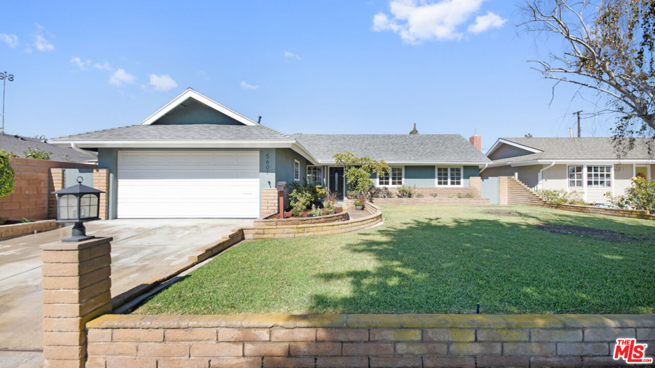 5601 Middlecoff Drive Huntington Beach, CA 92649 - Photo 12 of 49 a front view of a house with garden