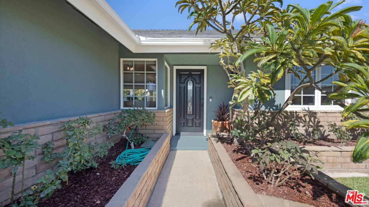 5601 Middlecoff Drive Huntington Beach, CA 92649 - Photo 14 of 49 a front view of a house with a yard