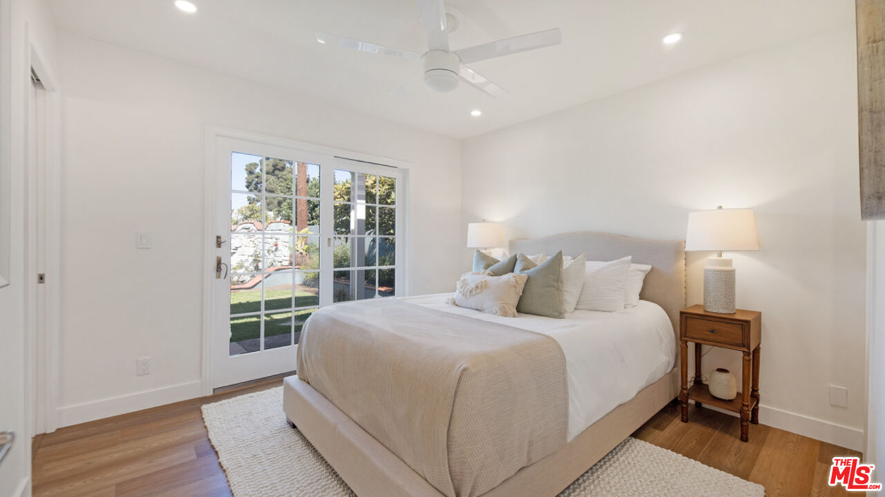 5601 Middlecoff Drive Huntington Beach, CA 92649 - Photo 16 of 49 a bedroom with a large bed and a window