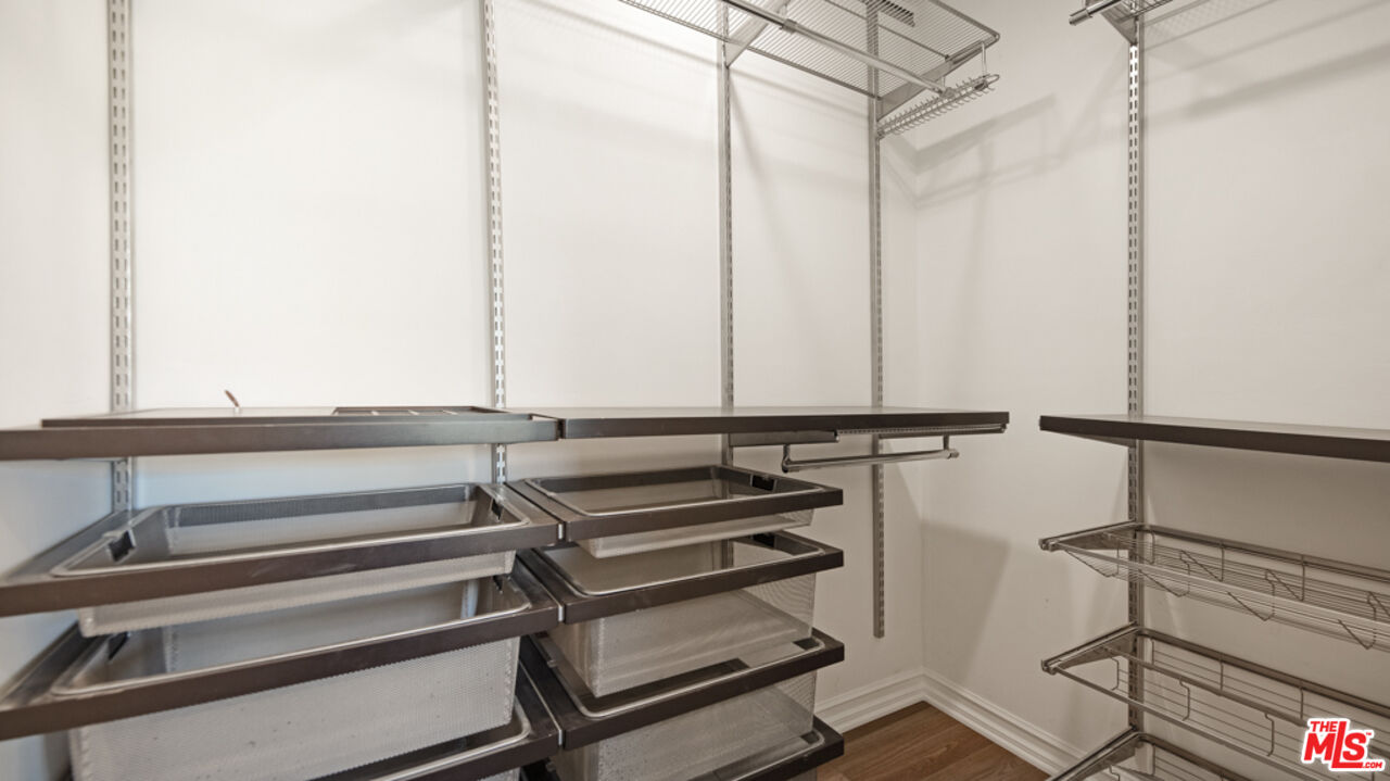 5601 Middlecoff Drive Huntington Beach, CA 92649 - Photo 19 of 49 a view of a room with lots of racks on the wall