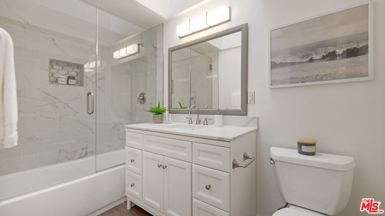 5601 Middlecoff Drive Huntington Beach, CA 92649 - Photo 20 of 49 a bathroom with a sink a toilet and shower