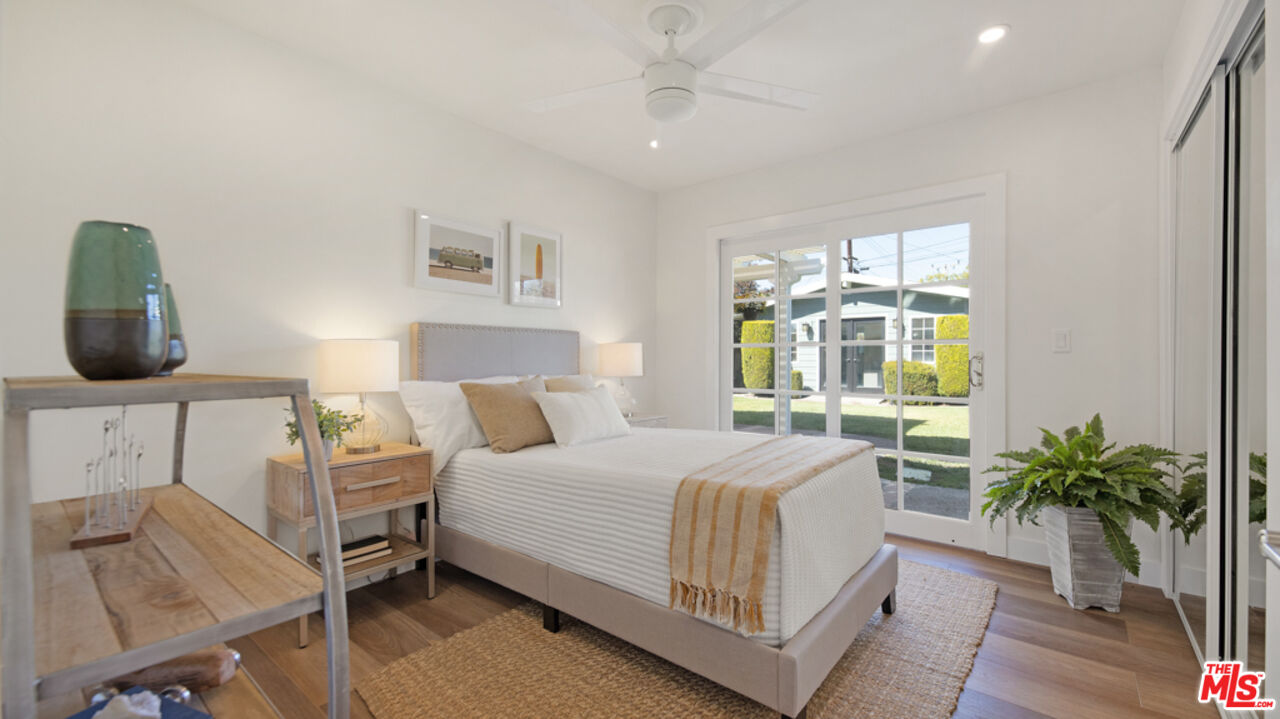 5601 Middlecoff Drive Huntington Beach, CA 92649 - Photo 22 of 49 a bedroom with a bed and window